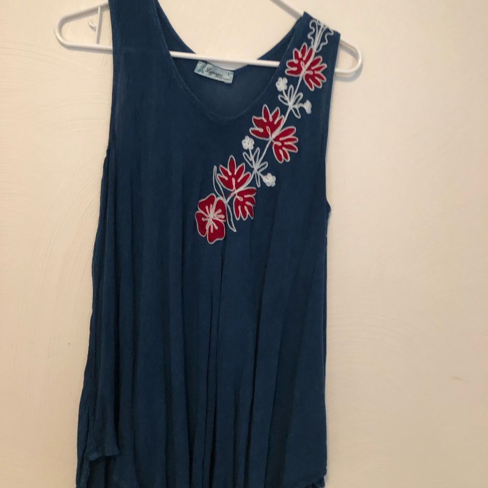 blue top with floral accent